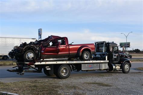 car hits tow truck accident